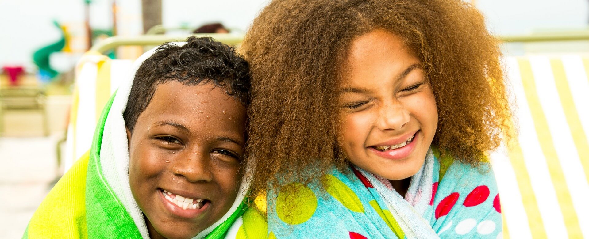 boy in towel at St. Pete Shores Hotel pool