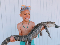 Guest holding Alligator